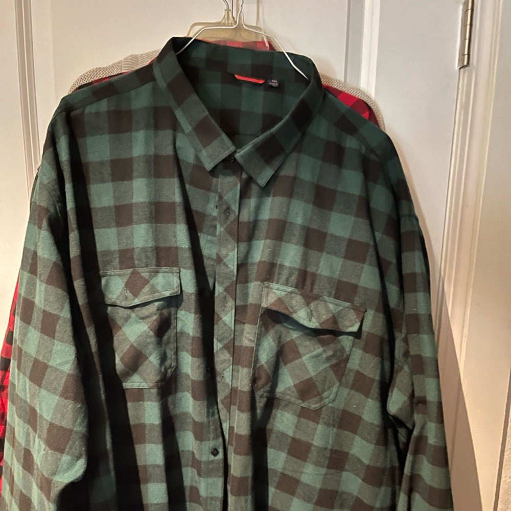 Two men’s flannel shirts.